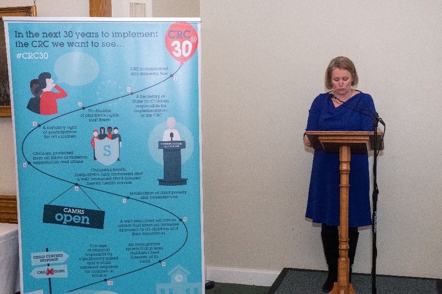 Woman standing at lectern