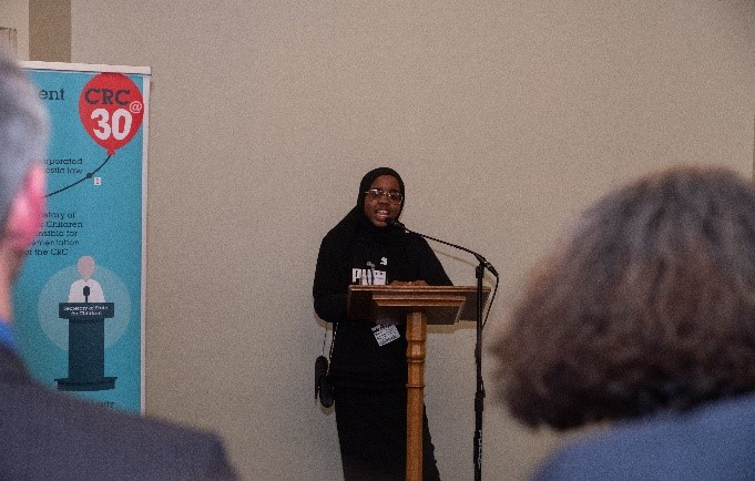 Fowiza and Siham speaking at a lectern