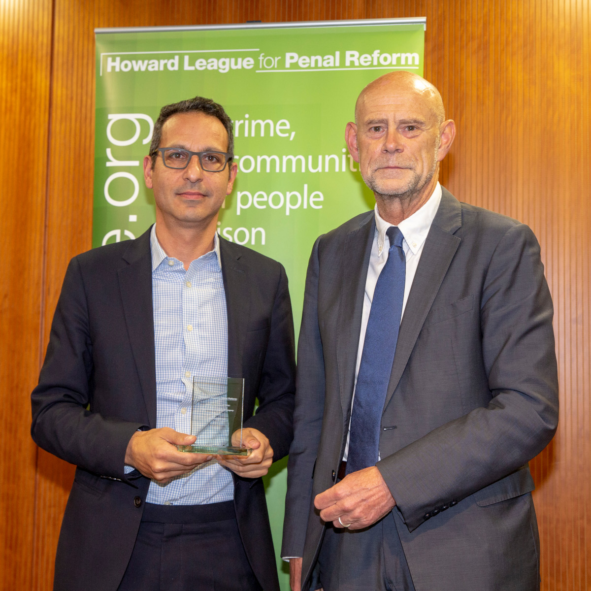 Just for Kids Law CEO Enver Solomon collects the Organisation of the Year award from Howard League trustee Gerry Marshall. The Howard League For Penal Reform's ‘Policing the community’ conference and Community Awards 2018 (photo by Andy Aitchison)